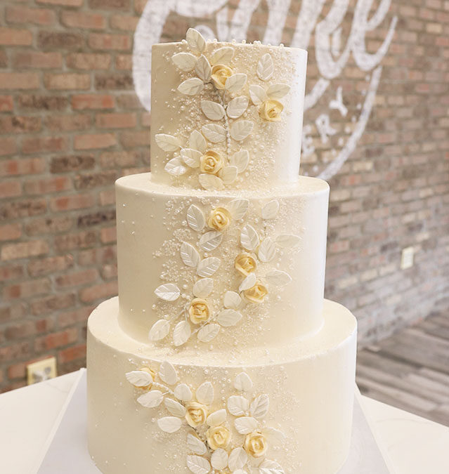 Buttercream iced wedding Cake With flower the applique 1