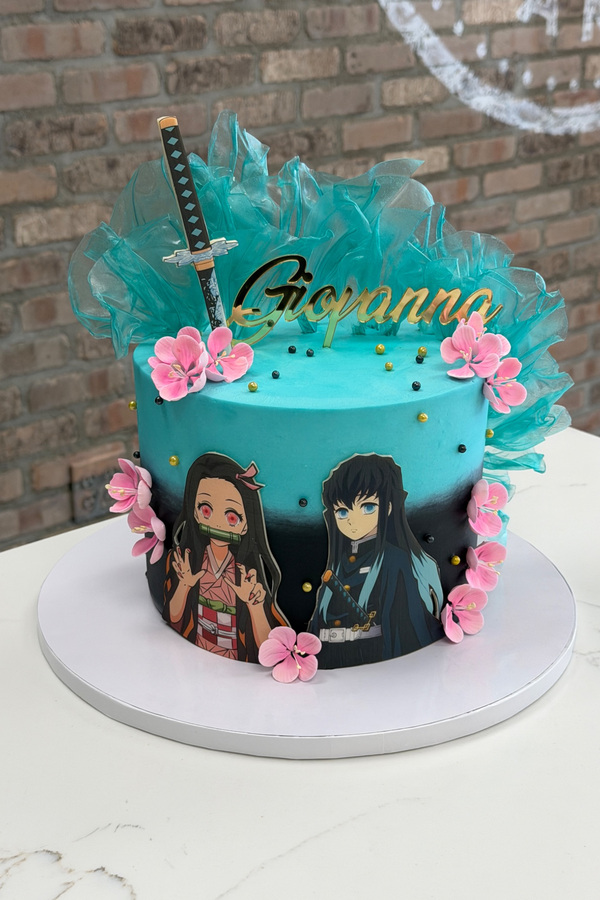 Demon Slayer anime cake with character artwork, katana, blossoms, decorative sails and personalized topper.